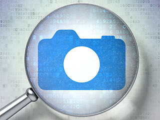 Image showing Vacation concept: Photo Camera with optical glass on digital background