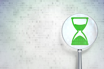 Image showing Time concept:  Hourglass with optical glass on digital background