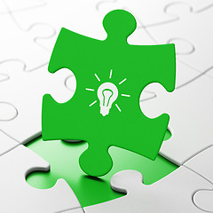 Image showing Business concept: Light Bulb on puzzle background