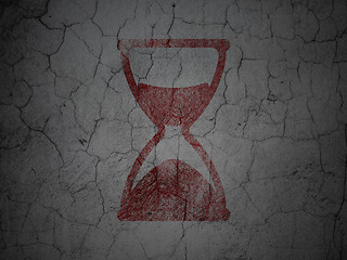 Image showing Timeline concept: Hourglass on grunge wall background