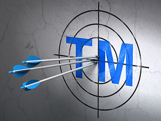 Image showing Law concept: arrows in Trademark target on wall background