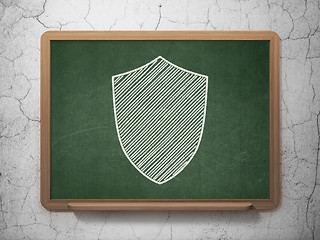 Image showing Protection concept: Shield on chalkboard background