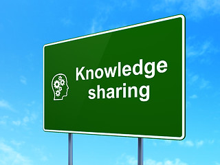 Image showing Education concept: Knowledge Sharing and Head With Gears on road sign background