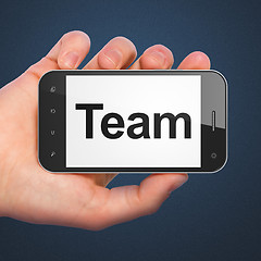 Image showing Business concept: Team on smartphone