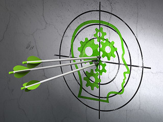 Image showing Finance concept: arrows in Head With Gears target on wall background
