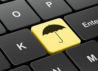 Image showing Security concept: Umbrella on computer keyboard background