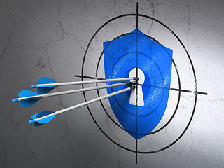 Image showing Safety concept: arrows in Shield With Keyhole target on wall background
