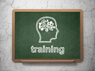 Image showing Education concept: Head With Finance Symbol and Training on chalkboard background