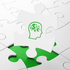 Image showing Advertising concept: Head With Finance Symbol on puzzle background