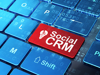 Image showing Finance concept: Light Bulb and Social CRM on computer keyboard background