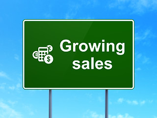 Image showing Finance concept: Growing Sales and Calculator on road sign background