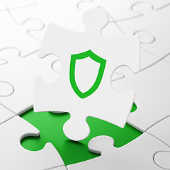 Image showing Security concept: Contoured Shield on puzzle background