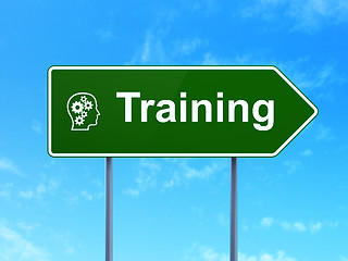 Image showing Education concept: Training and Head With Gears on road sign background