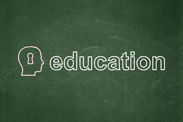 Image showing Education concept: Head With Keyhole and Education on chalkboard background