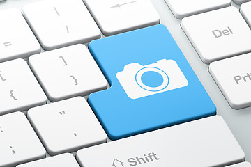 Image showing Tourism concept: Photo Camera on computer keyboard background