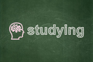 Image showing Education concept: Head With Finance Symbol and Studying on chalkboard background