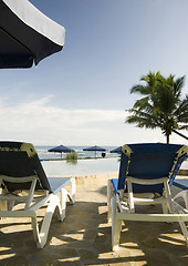 Image showing lounge chairs by pool