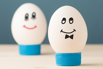 Image showing Two white eggs with smiles, male and female, man and woman.