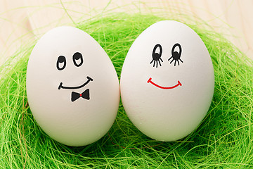 Image showing Two white eggs with smiles, male and female, man and woman.