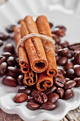 Image showing stack of cinnamon sticks and coffee beans