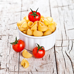 Image showing uncooked pasta and cherry tomatoes in a bowl