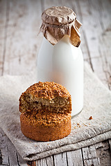 Image showing bottle of fresh milk and fresh baked bread 