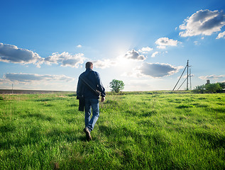 Image showing Man walking on the field