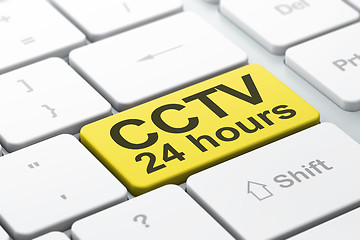 Image showing Protection concept: CCTV 24 hours on computer keyboard background
