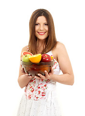 Image showing brunette girl holding cup of fruits