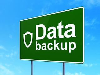 Image showing Information concept: Data Backup and Contoured Shield on road sign background