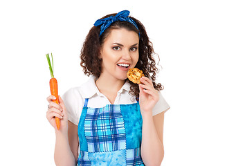 Image showing Girl with carrot and cookie