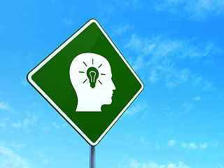 Image showing Education concept: Head With Light Bulb on road sign background