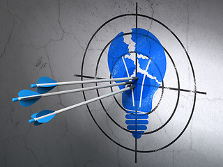 Image showing Business concept: arrows in Light Bulb target on wall background