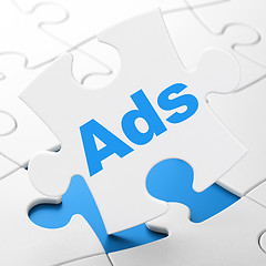 Image showing Advertising concept: Ads on puzzle background