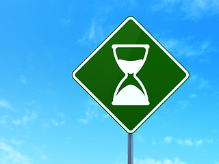 Image showing Timeline concept: Hourglass on road sign background