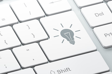 Image showing Finance concept: Light Bulb on computer keyboard background