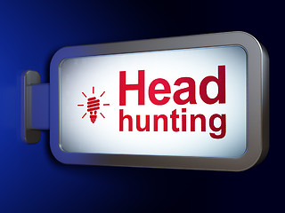 Image showing Finance concept: Head Hunting and Energy Saving Lamp on billboard background