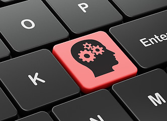 Image showing Advertising concept: Head With Gears on keyboard background