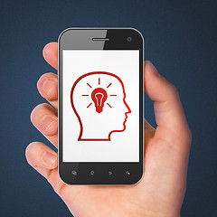 Image showing Marketing concept: Head With Lightbulb on smartphone