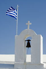 Image showing greek island church and bells with flag