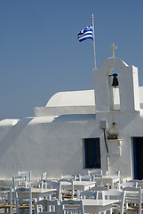 Image showing greek island church and bells with flag