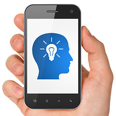 Image showing Finance concept: Head With Light Bulb on smartphone