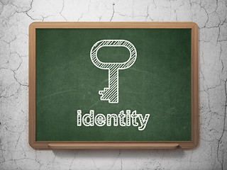 Image showing Safety concept: Key and Identity on chalkboard background