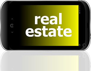 Image showing digital smartphone with real estate words, business concept