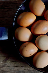 Image showing raw eggs in pan