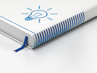 Image showing Business concept: closed book, Light Bulb on white background