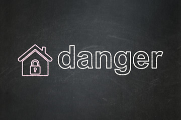 Image showing Protection concept: Home and Danger on chalkboard background