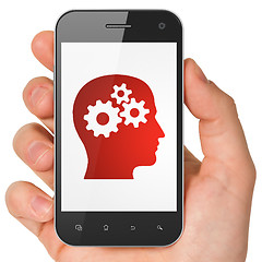 Image showing Marketing concept: Head With Gears on smartphone