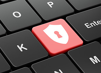 Image showing Protection concept: Shield With Keyhole on keyboard background