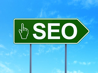 Image showing Web design concept: SEO and Mouse Cursor on road sign background